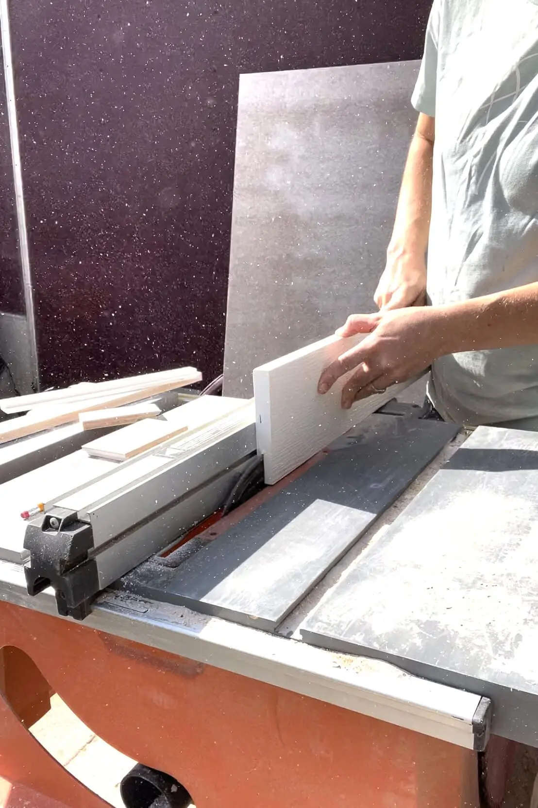 Cutting PVC trim on a table saw.